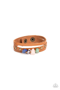 Chunks of jade, rose quartz, amethyst, and lapis lazuli stones are threaded along a knotted cord that is studded in place along the center band of a layered leather bracelet for a seasonal finish. Features an adjustable snap closure.  Sold as one individual bracelet.