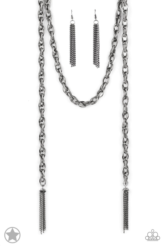 A single strand of spiraling, interlocking links with light-catching texture is anchored by two tassels of chain that add dramatic length to the piece. Undeniably the most versatile piece in Paparazzi's history, the scarf necklace features FIVE different ways to accessorize: Open Layer, Loop, Traditional Wrap, Double Knot, and Nautical Knot.  Sold as one individual necklace. Includes one pair of matching earrings