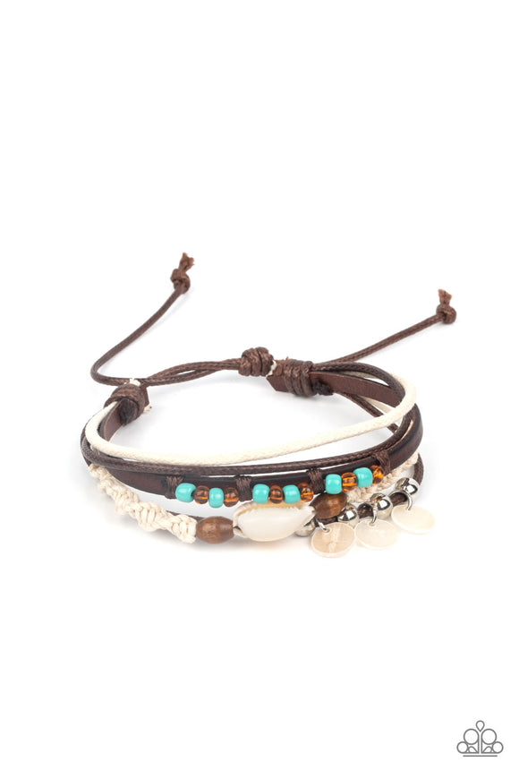 An assortment of colorful seed beads, white shells, and earthy wooden accents adorns mismatched strands of leather and colorful cording around the wrist for a summery vibe. Features an adjustable sliding knot closure.  Sold as one individual bracelet.