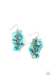 Turquoise pebbles are threaded along silver rods along a single silver chain, clustering into an earthy tassel for an artisan inspired fashion. Earring attaches to a standard fishhook fitting.  Sold as one pair of earrings.