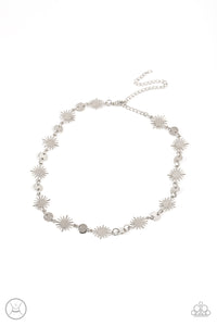 Dainty silver discs delicately alternate with starry silver sunbursts, linking into a celestial centerpiece around the neck. Features an adjustable clasp closure.  Sold as one individual choker necklace. Includes one pair of matching earrings.