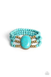 Set in an antiqued brass frame, an oversized oval turquoise stone is held in place at the center of the wrist by stretchy rows of brass and turquoise stone beads for an artisan inspired flair.  Sold as one individual bracelet.