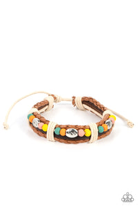 Multicolored wooden beads and textured silver accents are threaded along a natural cord atop a dark brown leather band. Light brown braided leather bands create a border as the collection is wrapped in sections with natural cording for a handcrafted look. Features an adjustable sliding knot closure.  Sold as one individual bracelet.