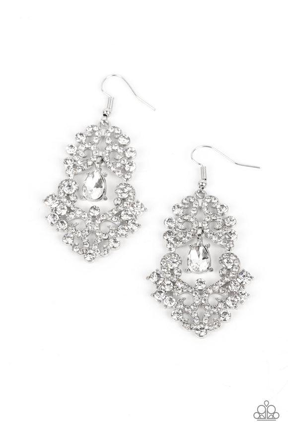 A sparkly white rhinestone swings from the top of a glittery explosion of white rhinestones that delicately scatter and curl into ribbons, coalescing into an effervescent chandelier. Earring attaches to a standard fishhook fitting.  Sold as one pair of earrings.