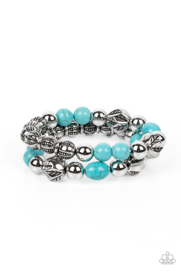Stamped in leafy accents, faceted silver beads join refreshing turquoise stone beads, shiny silver beads, and textured silver accents along stretchy bands around the wrist for an earthy layered look.  Sold as one pair of bracelets.