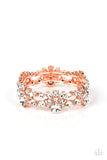 Crowned with an exquisite white rhinestone, stacks of round and marquise cut rhinestones coalesce into scintillating clusters. The glassy clusters of shiny copper frames are threaded along stretchy bands creating a dazzling display around the wrist.  Sold as one individual bracelet.