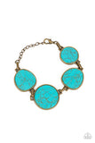 Flat turquoise stones pressed into brass frames provide a statement focal point around the wrist. Features an adjustable clasp closure. As the stone elements in this piece are natural, some color variation is normal.  Sold as one individual bracelet.