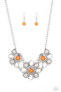 Dotted with orange bead centers, silver and white shell-like petals fan out from an airy metal frame. The trio of whimsically industrial flowers connects to a conventional silver chain below the collar resulting in an unabashedly metropolitan display. Features an adjustable clasp closure.  Sold as one individual necklace. Includes one pair of matching earrings.