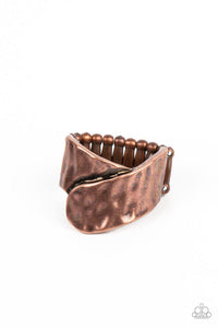 Two wide copper ribbons are hammered in texture as they delicately overlap at the center of the finger to create a rustic metallic statement piece. Features a stretchy band for a flexible fit.  Sold as one individual ring.