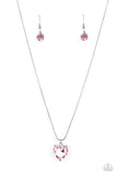 A heart-shaped rhinestone brushed in a pink finish sparkles brilliantly as it slides along a skinny silver snake chain. The gem is pressed into a thick silver frame, allowing its faceted surface to be emphasized. Features an adjustable clasp closure.  Sold as one individual necklace. Includes one pair of matching earrings.