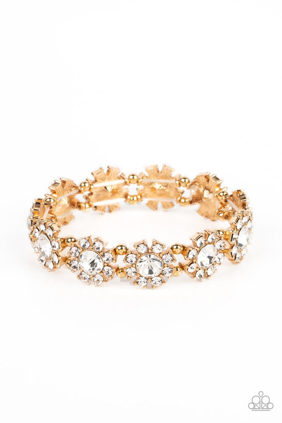 Separated by pairs of dainty gold beads, rhinestone-dotted petals bloom from oversized white rhinestone centers along stretchy bands around the wrist for a flirtatious floral fashion.  Sold as one individual bracelet.