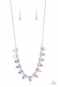 Solitaire white rhinestones sparkle atop iridescent prism-like gems below the collar, linking into a sharp-looking statement piece. Features an adjustable clasp closure. Due to its prismatic palette, color may vary.  Sold as one individual necklace. Includes one pair of matching earrings.