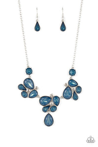 Draped elegantly across the chest, clusters of geometric blue gems, brushed in the fall Pantone® of Midnight, gather around sparkling white rhinestones, creating a bright and beautiful pattern. Features an adjustable clasp closure.  Sold as one individual necklace. Includes one pair of matching earrings.