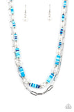 Sections of colorful rubber discs in shades of blue, turquoise, and navy are separated by tiny silver beads and a variety of white baroque pearls to create an unexpected mashup of texture along the collar. A strand of silver paperclip link chain is paired with the abstract design in a layered finish. Features an adjustable clasp closure.   Featured inside The Preview at GLOW! Sold as one individual necklace. Includes one pair of matching earrings.  New Kit