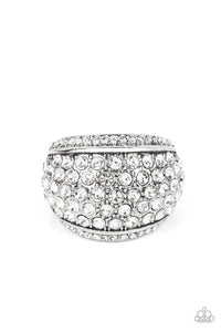 A thick band of silver arcs across the top of the finger, creating an exaggerated rounded frame. Countless tiny white rhinestones scatter across the surface, as straight lines of even more rhinestones line the outer edges in a blinding finish. Features a stretchy band for a flexible fit.  Sold as one individual ring.