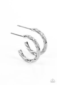 A delicate band of silver is etched in linear textures, curling around the ear to create a small, classic hoop. Earring attaches to a standard post fitting. Hoop measures approximately 1/2" in diameter.  Sold as one pair of hoop earrings.