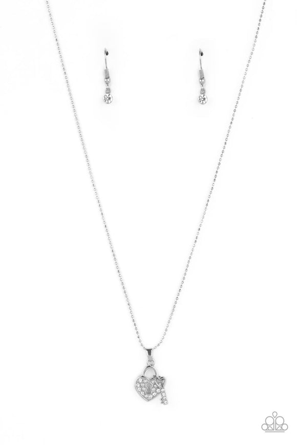 A small, heart-shaped pendant is filled with tiny white rhinestones that wrap around a keyhole cutout at its center. A small silver key, dotted with dainty white rhinestones and featuring a heart-shaped silhouette at the top, slides along the skinny silver ball chain next to the lock, completing the set. Features an adjustable clasp closure.  Sold as one individual necklace. Includes one pair of matching earrings.