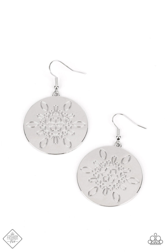 A silver disc is brushed in a high-sheen finish, radiating sheen in every direction as it swings from the ear. An intricate floral design is stamped into each side of the disc, adding a whimsical touch to the charming lure. Earring attaches to a standard fishhook fitting.  Sold as one pair of earrings.