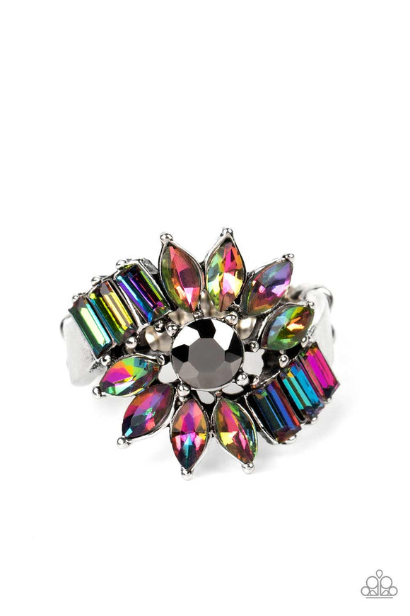 Marquise-cut rhinestone petals, splashed in an oil spill finish, fan out in an abstract manner around a hematite center. Dramatic emerald-cuts, set in a similar oil spill shade, fall in line along twisting bands of silver, exploding into a stellar centerpiece atop the finger. Features a stretchy band for a flexible fit. Due to its prismatic palette, color may vary.  Sold as one individual ring.