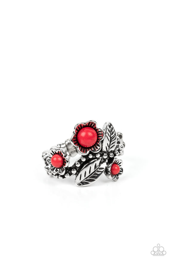 Featuring studded and stony textures, shimmery silver studs traverse across the finger, creating an airy band. Stemming from the studs, intricate silver flowers bloom from red stony centers, while detailed silver leaves haphazardly sprinkle across the free-spirited, floral arrangement. Features a dainty stretchy band for a flexible fit. As the stone elements in this piece are natural, some color variation is normal.  Sold as one individual ring.
