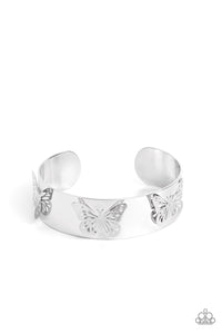 Three shimmery silver butterflies flutter atop the wrist on a thick silver cuff for a whimsical finish.  Sold as one individual bracelet.