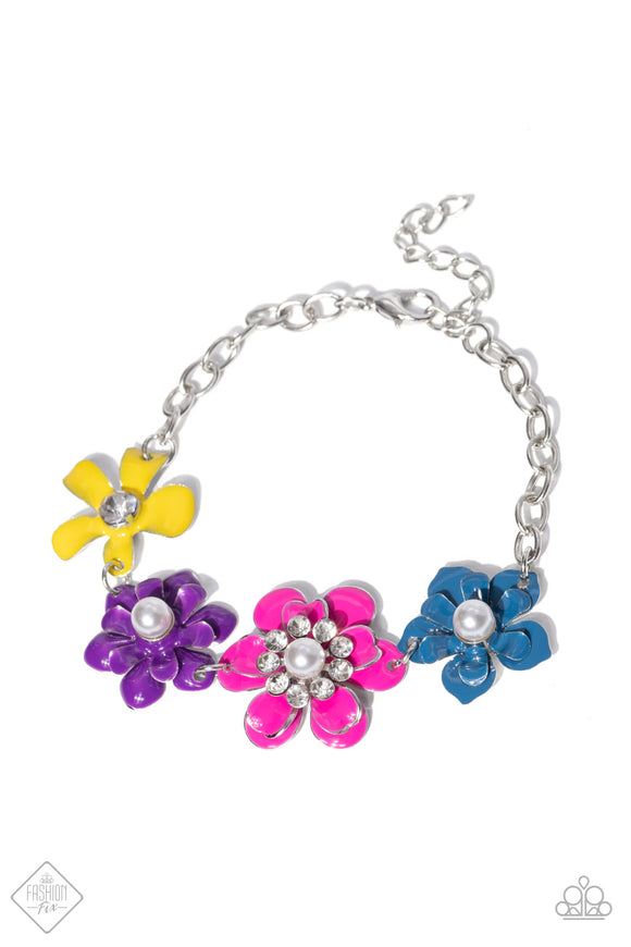 A collection of colorful flowers link around the wrist to create a vibrant statement piece. A mix of shimmery pearls and sparkling white rhinestones decorate the center of each flower, infusing the piece with handcrafted whimsicality. Features an adjustable clasp closure.  Sold as one individual bracelet.