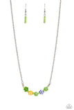 Infused at the bottom of a dainty silver chain, a row of flower beads in shades of green, yellow, and blue rest below the neckline. Separating each floral bead, green seed beads create additional pops of color against the seasonal flowers. Features an adjustable clasp closure.  Sold as one individual necklace. Includes one pair of matching earrings.