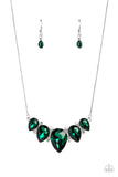 Featuring a dramatic emerald shade, a collection of teardrop gems hanging from a sleek, silver snake chain, are pressed into high-sheen silver casings, creating a colorful fringe below the collar. Linking each teardrop together, dainty white rhinestones border the tops and bottoms of each shape, creating additional eye-catching dazzle. Features an adjustable clasp closure.  Sold as one individual necklace. Includes one pair of matching earrings.