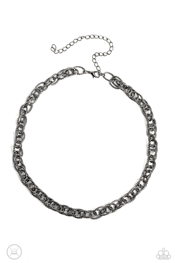 A strand of textured double gunmetal links drapes down the neckline in a stunning industrial display. The textured links catch and reflect the light at every angle, adding breathtaking shimmer to the monochromatic design. Features an adjustable clasp closure.  Sold as one individual choker necklace. Includes one pair of matching earrings.