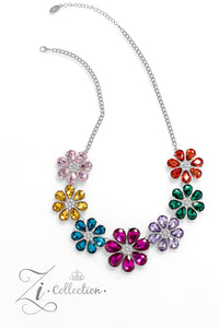 Colorful teardrop-shaped petals fan out around clusters of corrugated sparkle, blossoming into an enchanted kaleidoscope. The faceted surfaces of each petal add texture and depth, allowing the floral frames to pop with 3D detail and further highlight the spectrum of color at play. Features an adjustable clasp closure.  Sold as one individual necklace. Includes one pair of matching earrings.