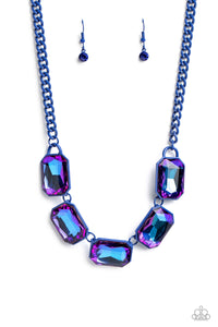 Featuring a vivacious blue chain, a collection of purple UV shimmery emerald-cut gems, pressed in vibrant blue frames, coalesces around the collar to create a playful pop of edgy color. Features an adjustable clasp closure.  Sold as one individual necklace. Includes one pair of matching earrings.