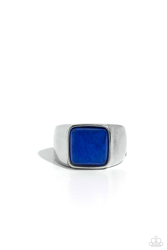 Chiseled into a tranquil square, an earthy lapis stone is pressed into the center of a bold rounded silver square frame for an urban finish. Features a stretchy band for a flexible fit. As the stone elements in this piece are natural, some color variation is normal.  Sold as one individual ring.