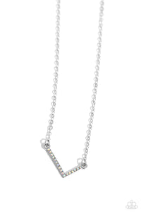 Embossed with dainty iridescent rhinestones, a silver letter "L" hovers below the collar from a dainty silver chain, for a sentimentally simple design. Features an adjustable clasp closure. Due to its prismatic palette, color may vary.  Sold as one individual necklace. Includes one pair of matching earrings.