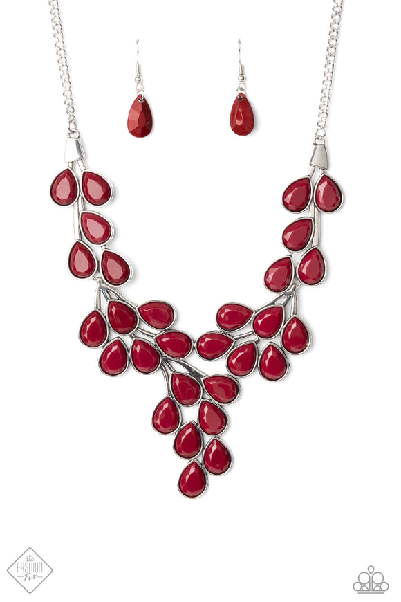 Teardrop shaped beads in the deep, rich shade of Wine are encased in sleek silver frames and clustered together in vine-like patterns. The faceted edges of the beads catch the light as they branch out below the collar, creating a substantial statement piece. Features an adjustable clasp closure.