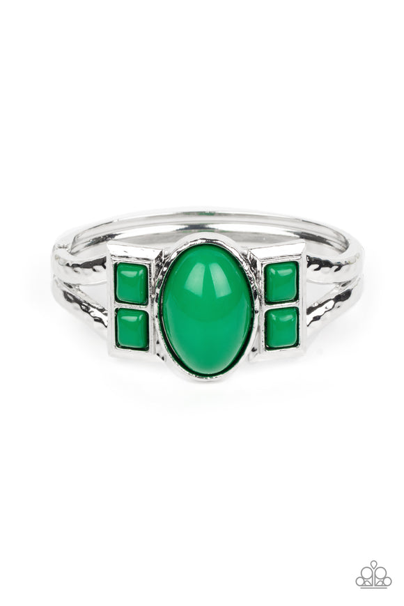 An oversized oval Leprechaun bead is flanked by pairs of stacked Leprechaun square beads across the center of a hammered silver bangle-like bracelet, creating a bold pop of color atop the wrist. Features a hinged closure.  Sold as one individual bracelet.